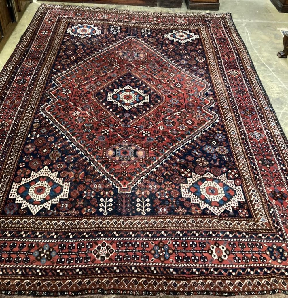 A Caucasian geometric red ground carpet, 320 x 230cm